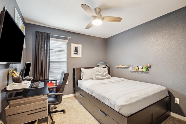 9833 Glen Brook Ln, Magnolia, TX 77354 - bedroom featuring light carpet, a textured wall, a desk, and a ceiling fan