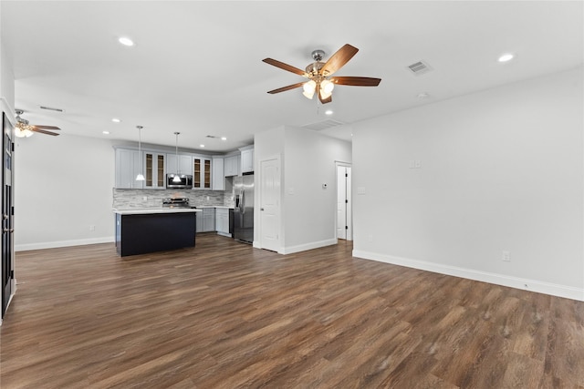 1603 Oleander Dr, La Marque, TX 77568 - unfurnished living room featuring ceiling fan, recessed lighting, dark wood finished floors, and baseboards