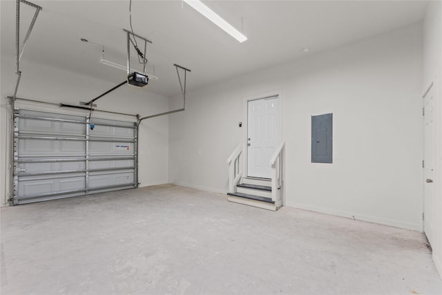 1603 Oleander Dr, La Marque, TX 77568 - garage featuring electric panel, a garage door opener, and baseboards