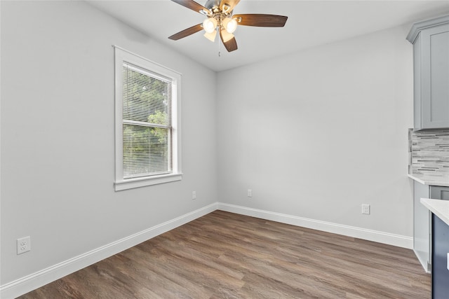 1603 Oleander Dr, La Marque, TX 77568 - spare room with wood finished floors, baseboards, and ceiling fan