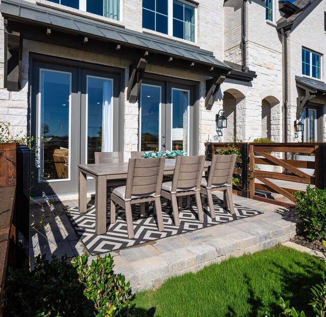 211 Cypress Pond Pl, Montgomery, TX 77316 - view of patio with outdoor dining space and french doors
