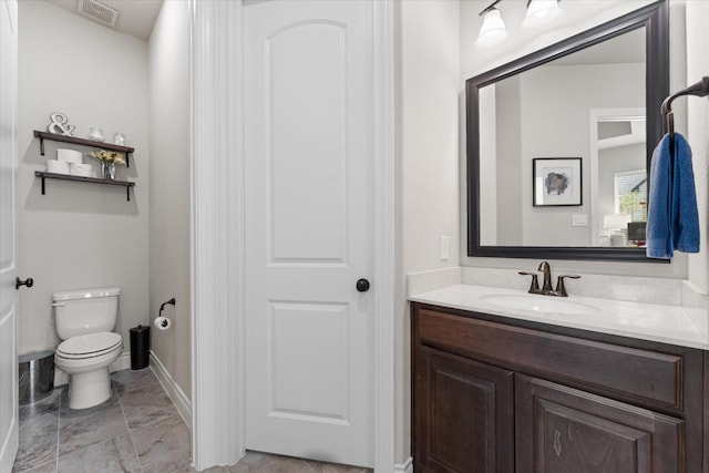bathroom featuring marble finish floor, visible vents, toilet, and vanity