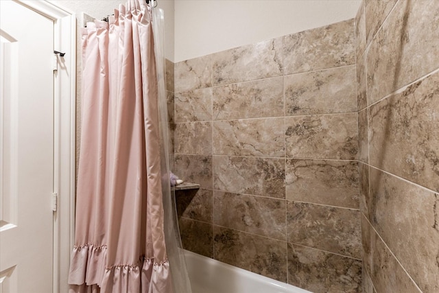 bathroom featuring shower / bath combo with shower curtain