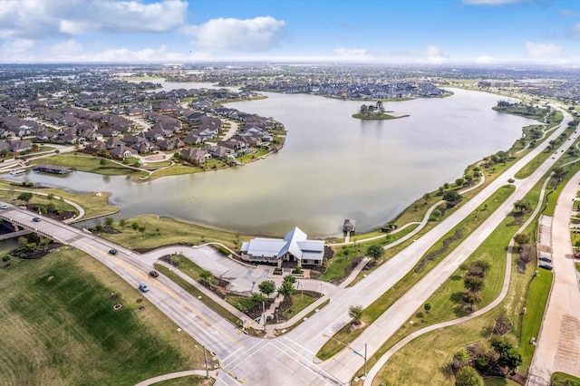 bird's eye view featuring a water view and a residential view