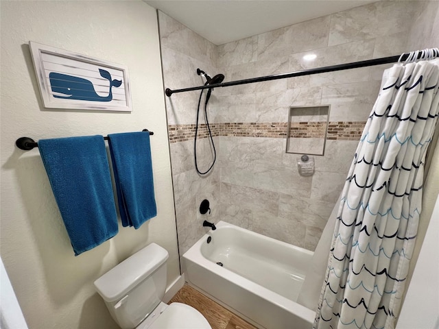 full bathroom with shower / tub combo with curtain and toilet