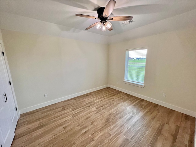 unfurnished bedroom featuring baseboards, ceiling fan, visible vents, and light wood-type flooring