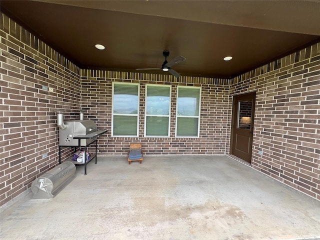 view of patio / terrace with grilling area and a ceiling fan