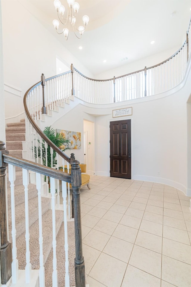 3002 Mildred Hill Ln, Richmond, TX 77406 - entryway featuring a towering ceiling, stairs, tile patterned flooring, and an inviting chandelier