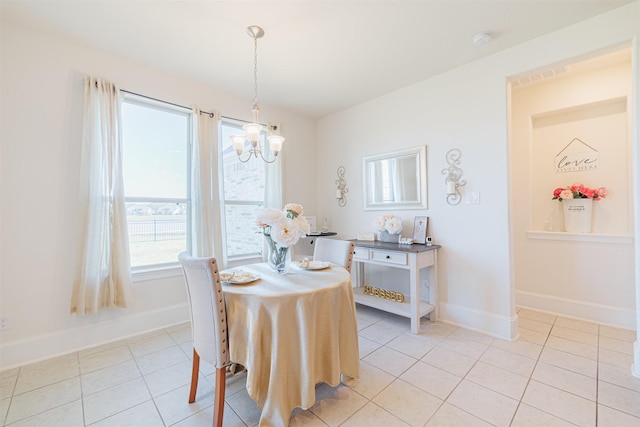 3002 Mildred Hill Ln, Richmond, TX 77406 - dining room with light tile patterned flooring, baseboards, and a notable chandelier