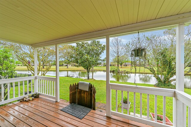 831 Woodfern Glen Ln, Pearland, TX 77584 - wooden deck featuring a water view and a lawn