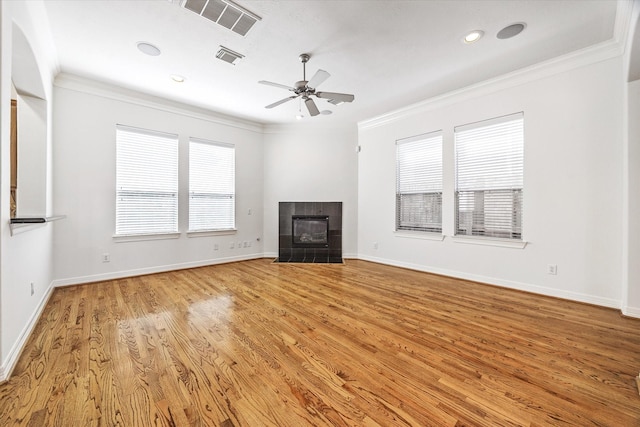 5309 Elm St, Houston, TX 77081 - unfurnished living room with light wood-style flooring, visible vents, baseboards, a fireplace, and ornamental molding
