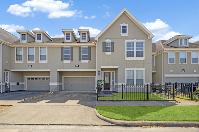 5309 Elm St, Houston, TX 77081 - view of property with stucco siding, an attached garage, and fence