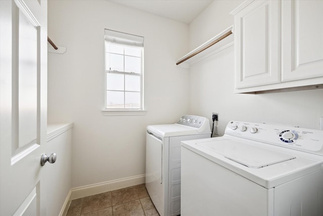 5309 Elm St, Houston, TX 77081 - clothes washing area with light tile patterned floors, cabinet space, washing machine and dryer, and baseboards