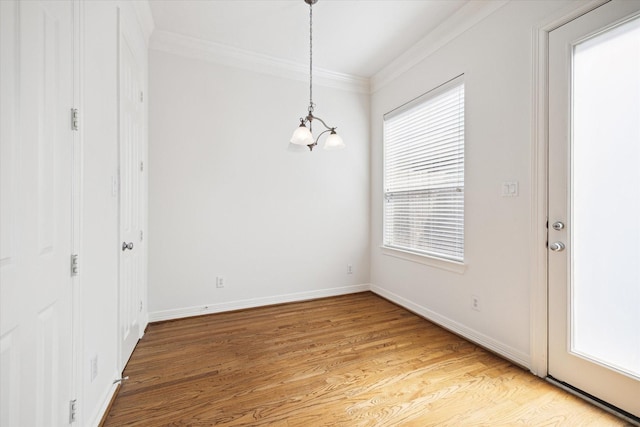 5309 Elm St, Houston, TX 77081 - unfurnished dining area with ornamental molding, baseboards, and light wood finished floors