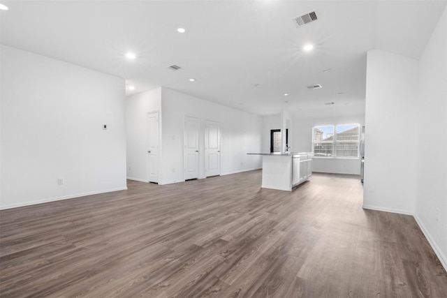 5135 Dunstable Manor Ln, Rosharon, TX 77583 - unfurnished living room with wood finished floors, recessed lighting, and baseboards