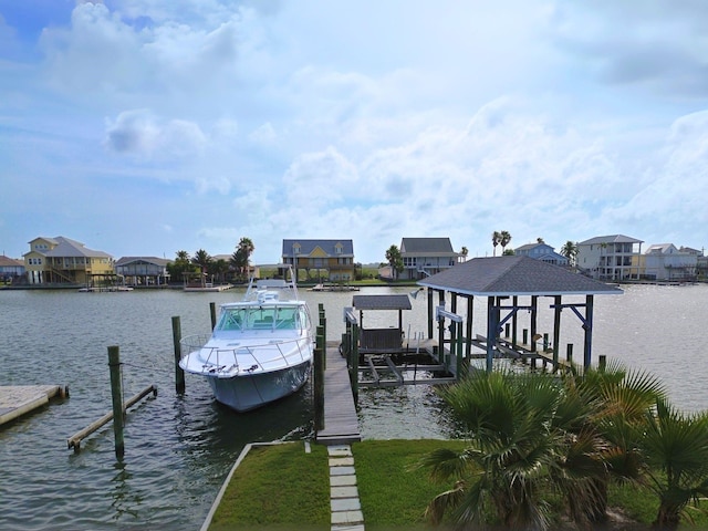 1243 Pilot Ln, Galveston, TX 77554 - dock featuring boat lift, a water view, and a residential view