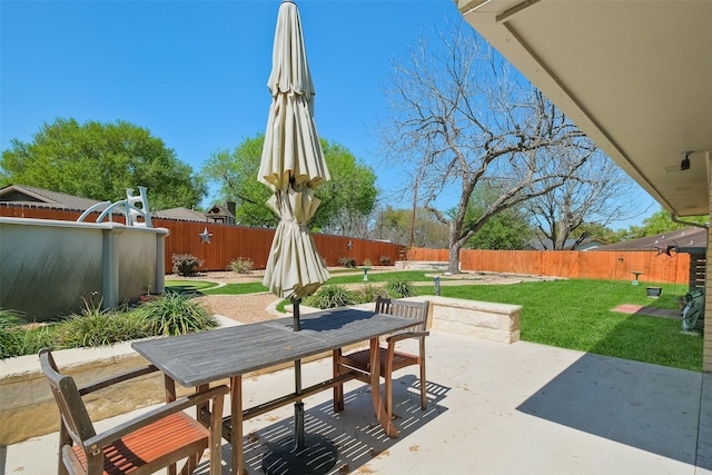 view of patio / terrace featuring a fenced backyard and outdoor dining space