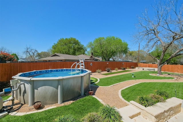 view of yard featuring a fenced backyard and a fenced in pool
