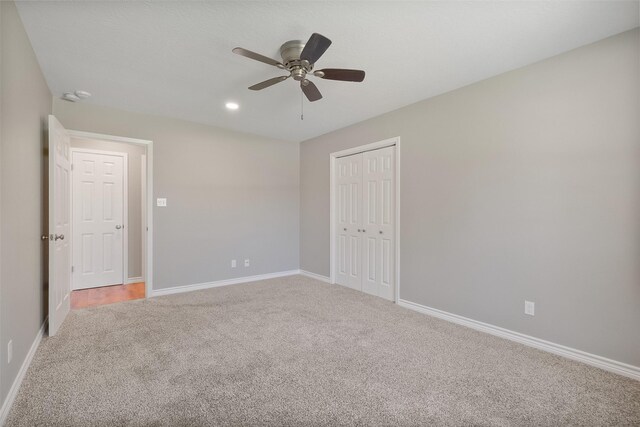 carpeted empty room featuring baseboards, ceiling fan, and recessed lighting