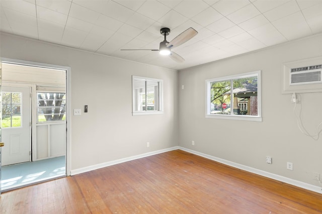 4605 Norhill Blvd, Houston, TX 77009 - unfurnished room featuring hardwood / wood-style flooring, baseboards, ceiling fan, ornamental molding, and an AC wall unit