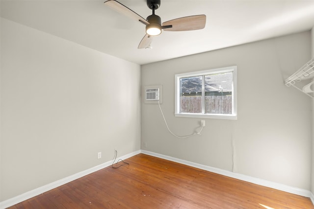 4605 Norhill Blvd, Houston, TX 77009 - empty room with baseboards, wood finished floors, a wall mounted air conditioner, and ceiling fan