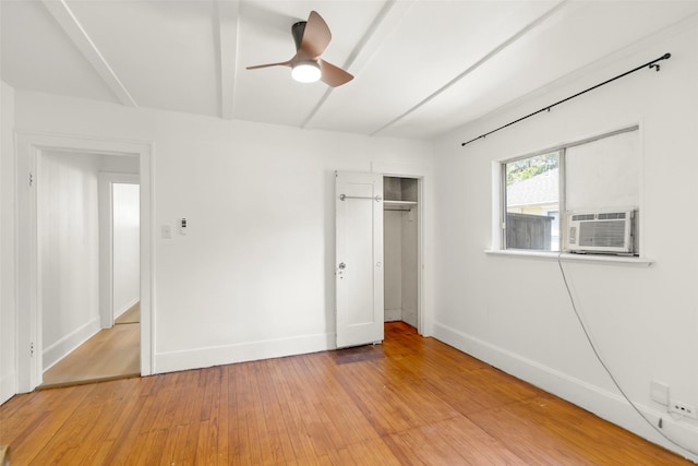 4605 Norhill Blvd, Houston, TX 77009 - unfurnished bedroom featuring a closet, baseboards, a ceiling fan, light wood-style floors, and cooling unit
