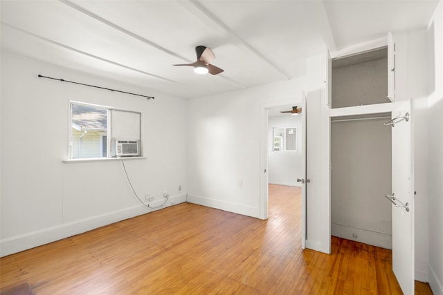 4605 Norhill Blvd, Houston, TX 77009 - unfurnished bedroom featuring cooling unit, light wood-type flooring, baseboards, ceiling fan, and a closet