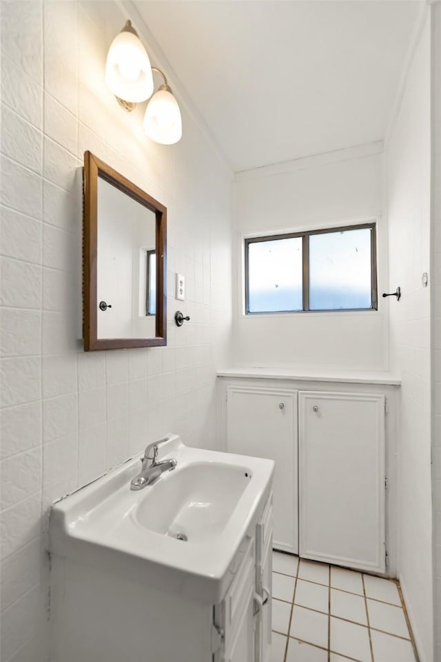 4605 Norhill Blvd, Houston, TX 77009 - bathroom with tile patterned floors, vanity, crown molding, and tile walls