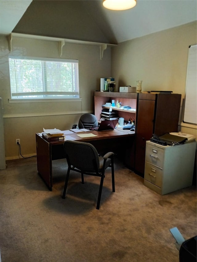 home office with carpet floors and vaulted ceiling