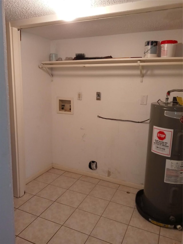 clothes washing area with hookup for an electric dryer, laundry area, light tile patterned floors, electric water heater, and hookup for a washing machine