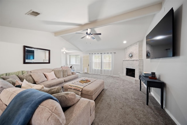 living area featuring vaulted ceiling with beams, a fireplace, visible vents, ceiling fan, and carpet