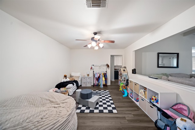 bedroom featuring wood finished floors, ceiling fan, and visible vents
