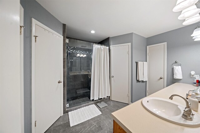bathroom featuring a stall shower and vanity