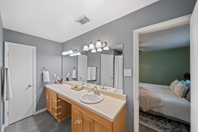full bath featuring tile patterned flooring, vanity, and visible vents