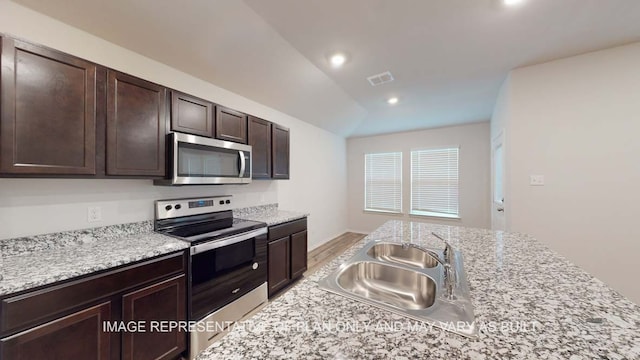 12520 Tarres Ct, Lorena, TX 76655 - kitchen with visible vents, recessed lighting, appliances with stainless steel finishes, dark brown cabinetry, and a sink