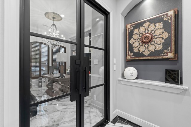 34 New Oak Trl, Humble, TX 77346 - entryway with marble tiled floors, a chandelier, baseboards, and crown molding