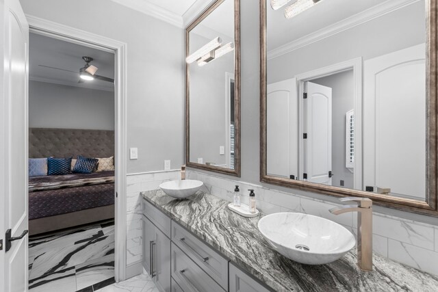 34 New Oak Trl, Humble, TX 77346 - bathroom with ensuite bath, crown molding, marble finish flooring, double vanity, and tile walls
