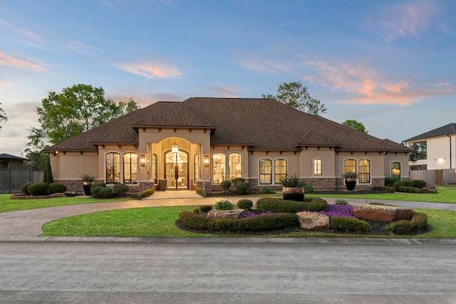 34 New Oak Trl, Humble, TX 77346 - view of front of house featuring stone siding, stucco siding, and curved driveway