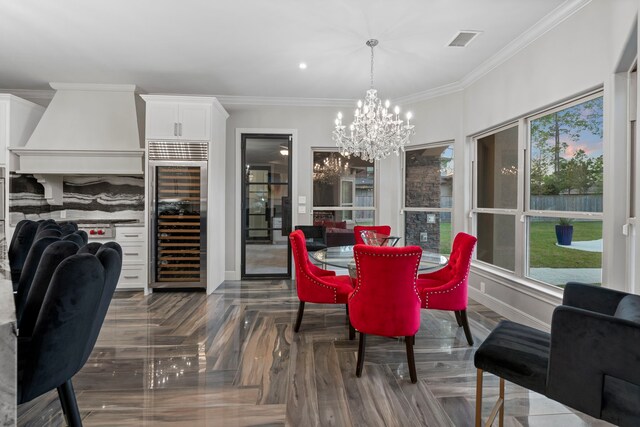 34 New Oak Trl, Humble, TX 77346 - dining room featuring beverage cooler, a chandelier, ornamental molding, plenty of natural light, and baseboards