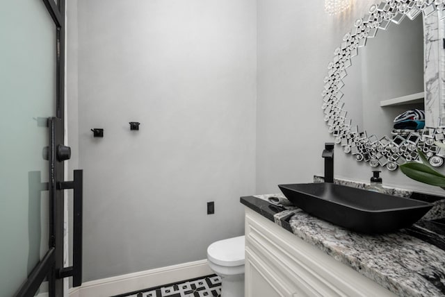 34 New Oak Trl, Humble, TX 77346 - bathroom with vanity, toilet, and baseboards