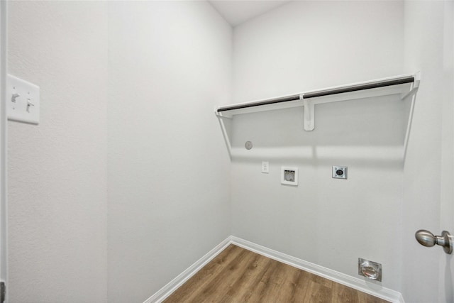 washroom featuring wood finished floors, laundry area, electric dryer hookup, washer hookup, and baseboards