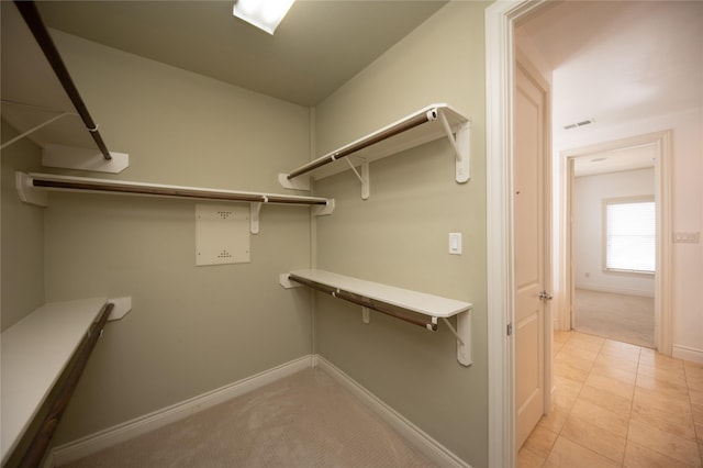 3249 Maxroy St, Houston, TX 77008 - spacious closet with visible vents and light tile patterned floors