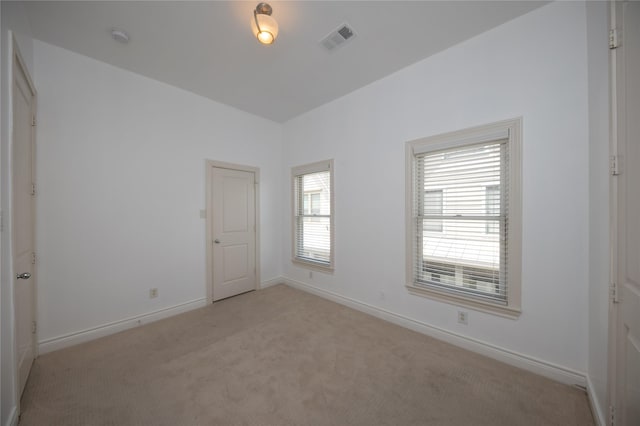 3249 Maxroy St, Houston, TX 77008 - empty room featuring light carpet, baseboards, and visible vents