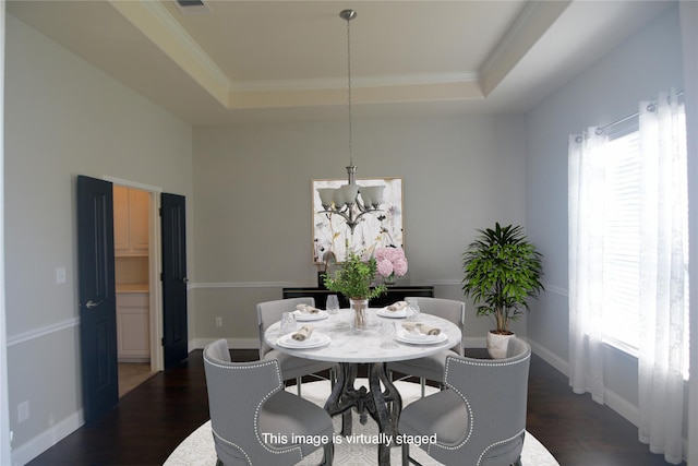 4321 Juniper Ln, Deer Park, TX 77536 - dining room featuring a raised ceiling, a chandelier, dark wood-style flooring, baseboards, and crown molding