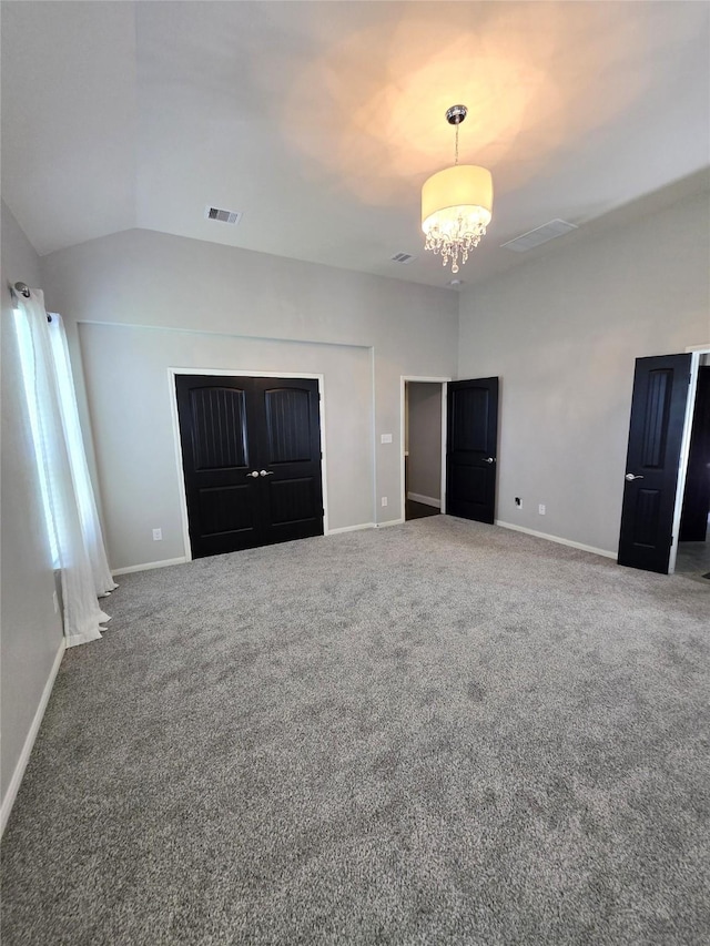 4321 Juniper Ln, Deer Park, TX 77536 - unfurnished bedroom with carpet flooring, a chandelier, vaulted ceiling, and baseboards