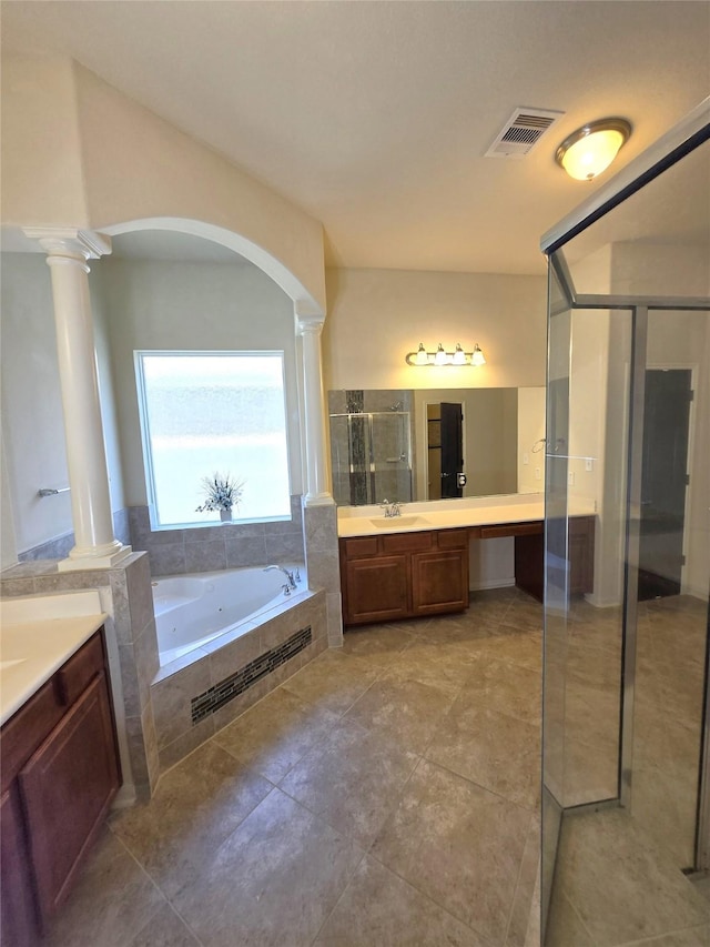 4321 Juniper Ln, Deer Park, TX 77536 - bathroom featuring ornate columns, a shower stall, a bath, and vanity