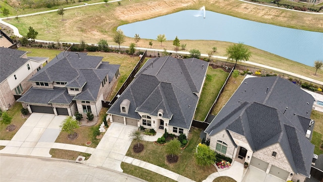 bird's eye view with a water view and a residential view