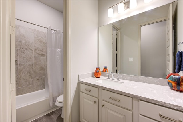 bathroom with shower / bath combo, toilet, vanity, and wood finished floors