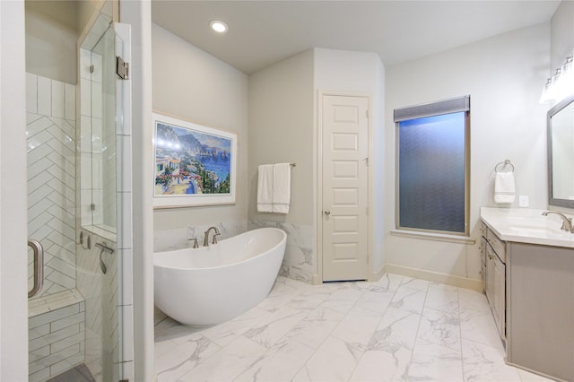 bathroom with a soaking tub, a shower stall, marble finish floor, recessed lighting, and vanity