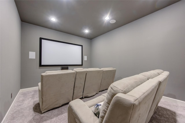home theater room featuring light carpet, baseboards, and recessed lighting
